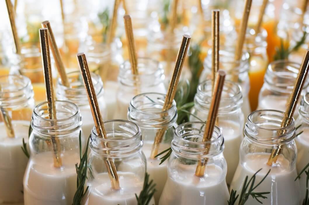 jars of milk with gold straws