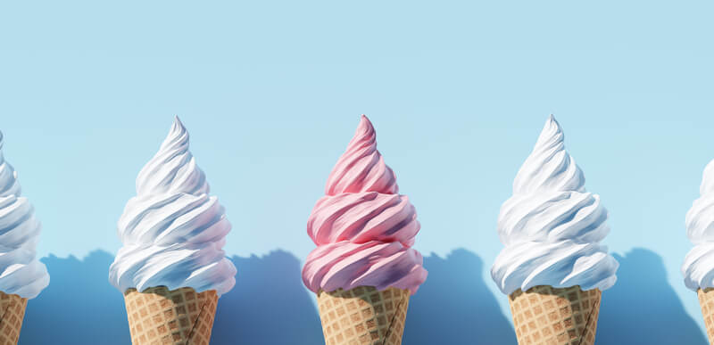 three soft serve ice cream cones on light blue background