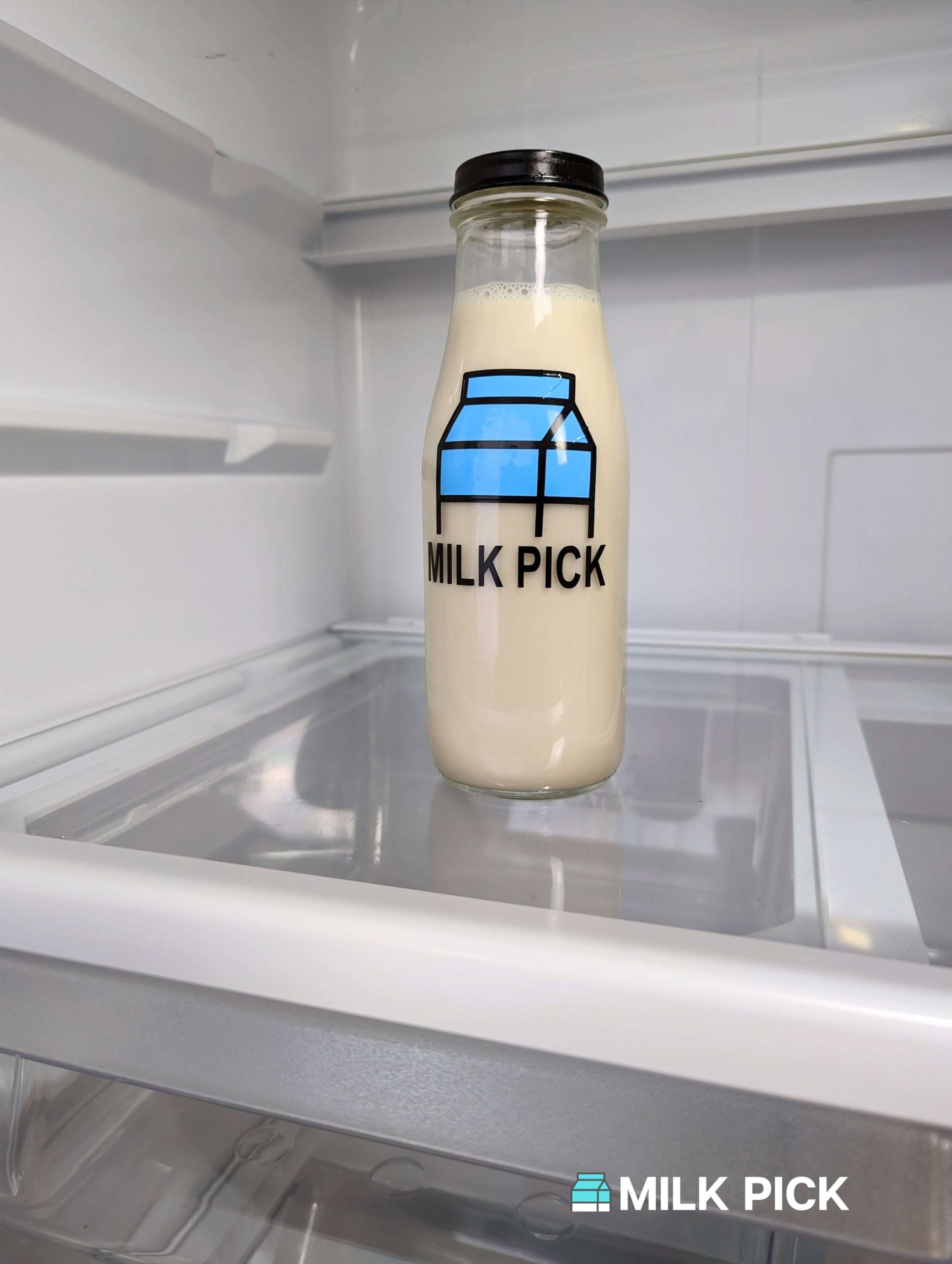 oat milk in glass bottle in refrigerator