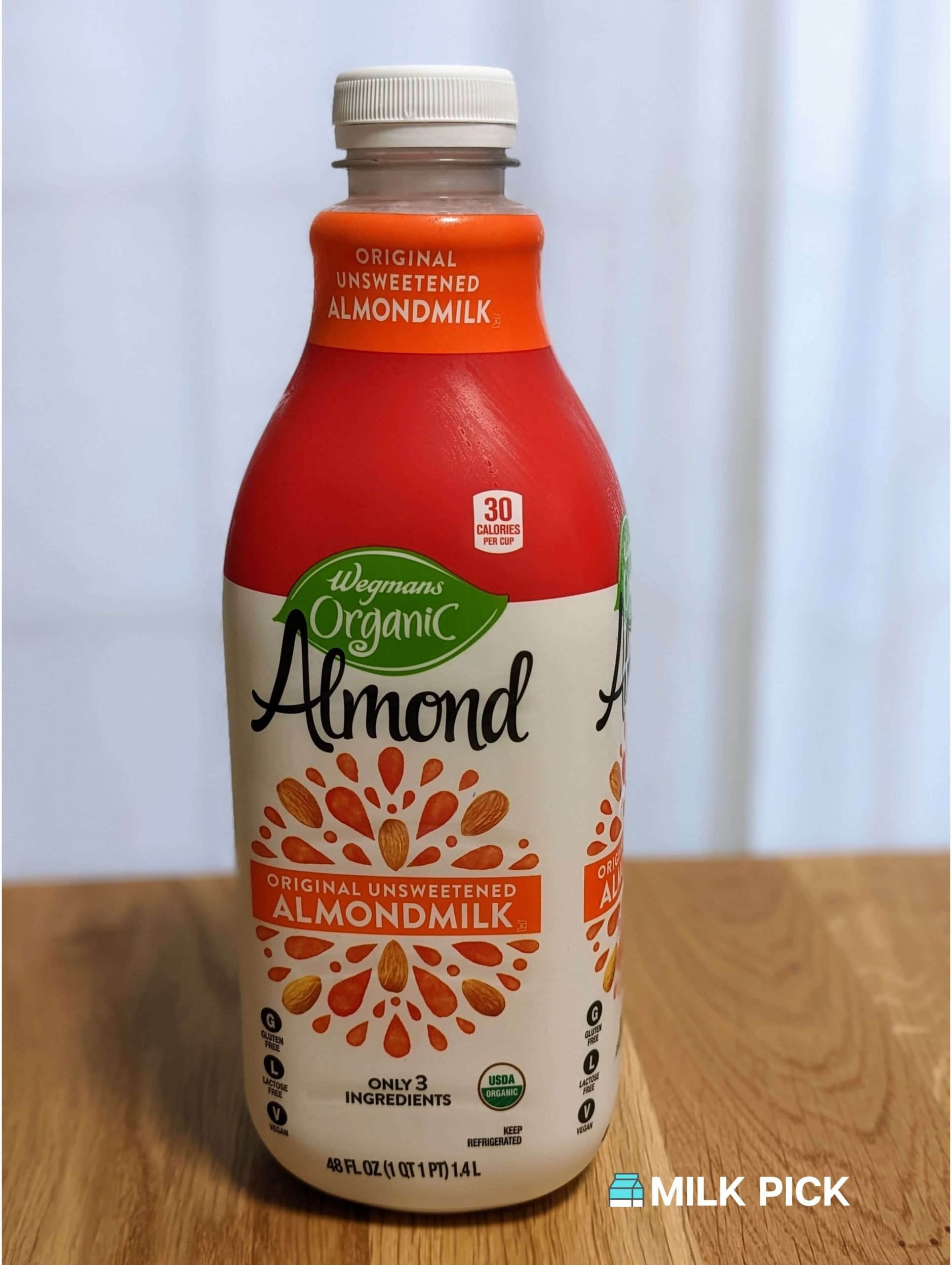 wegmans organic almond milk on kitchen island
