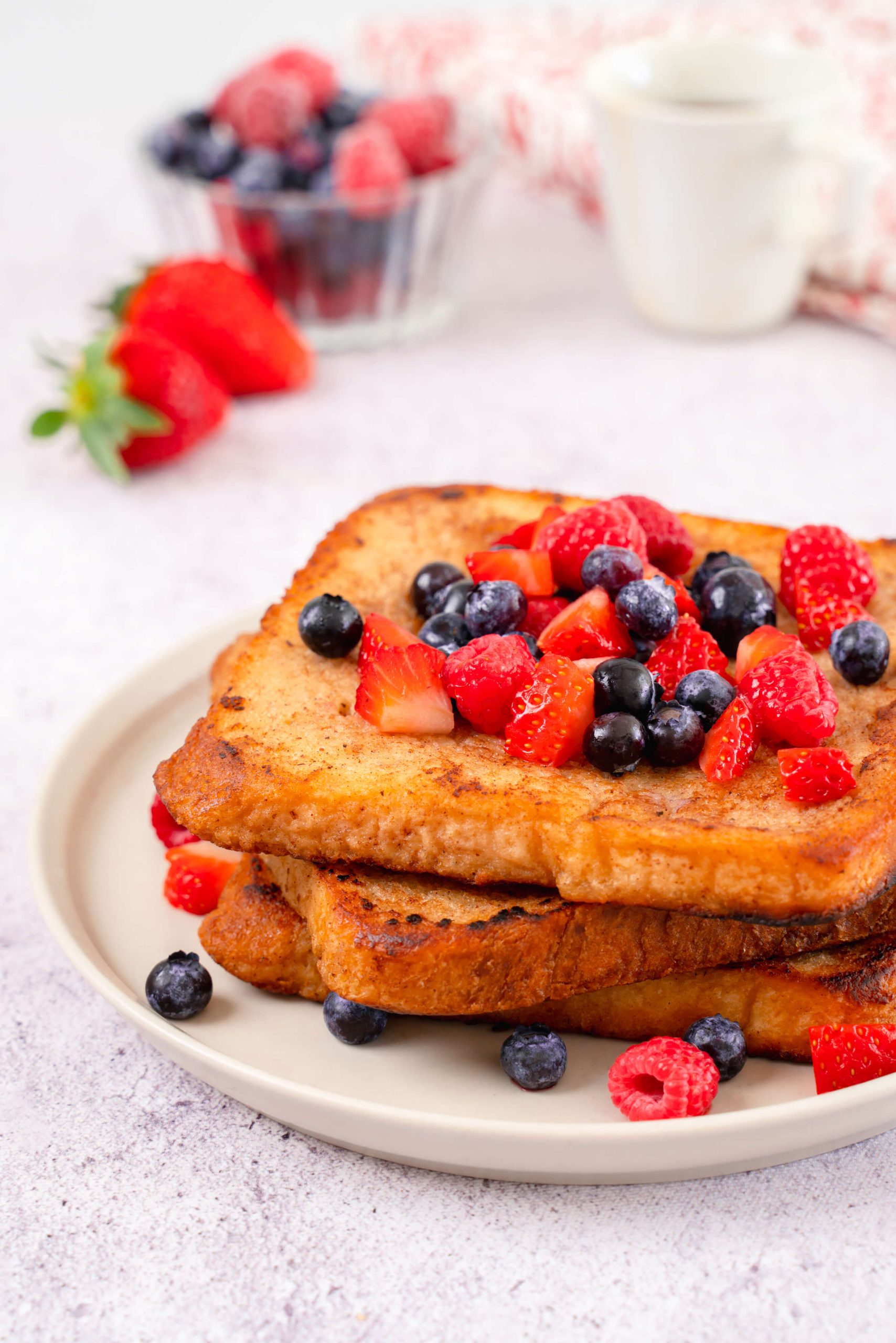 almond milk french toast topped with fresh berries