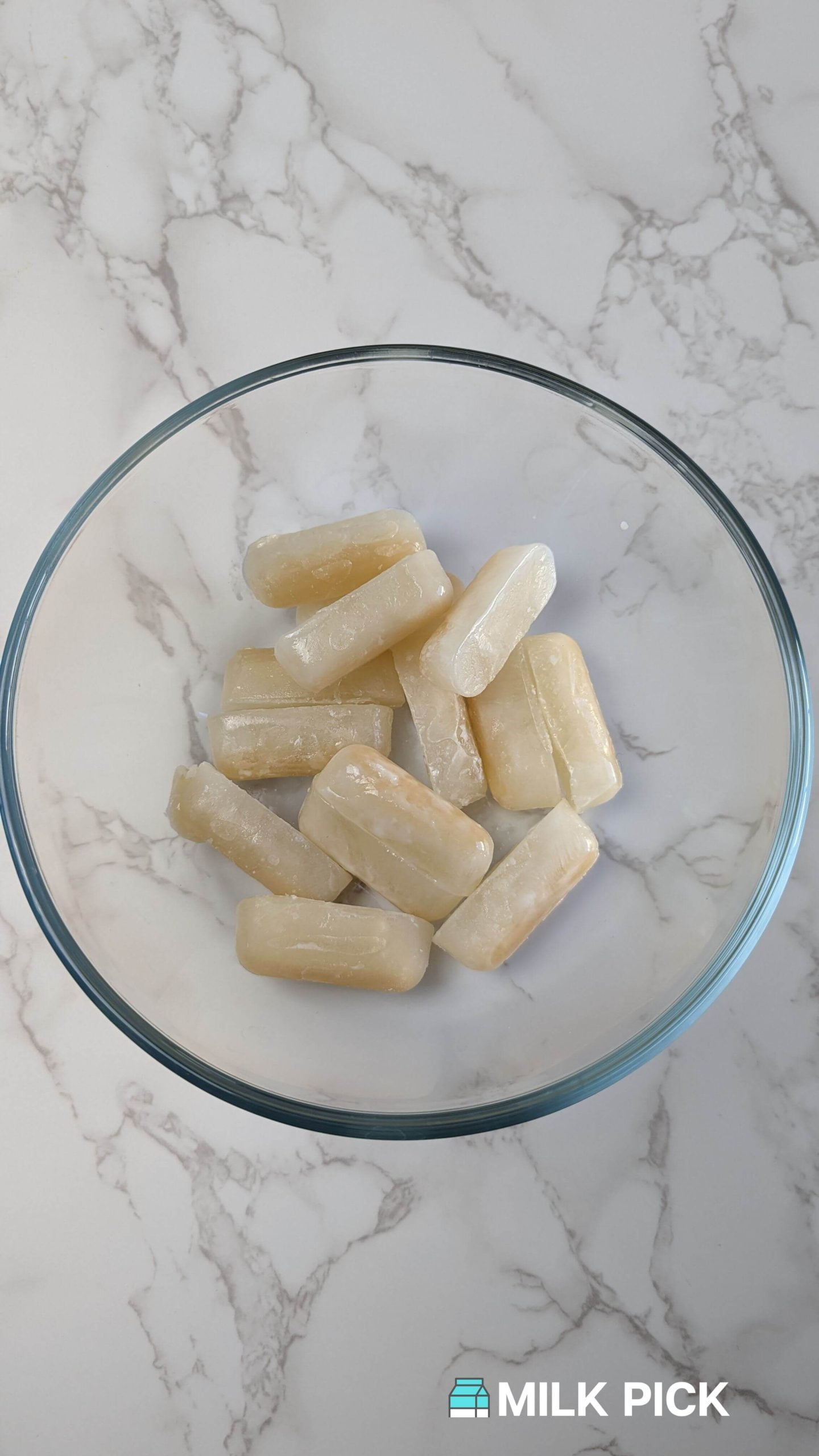 frozen almond milk cubes in glass bowl