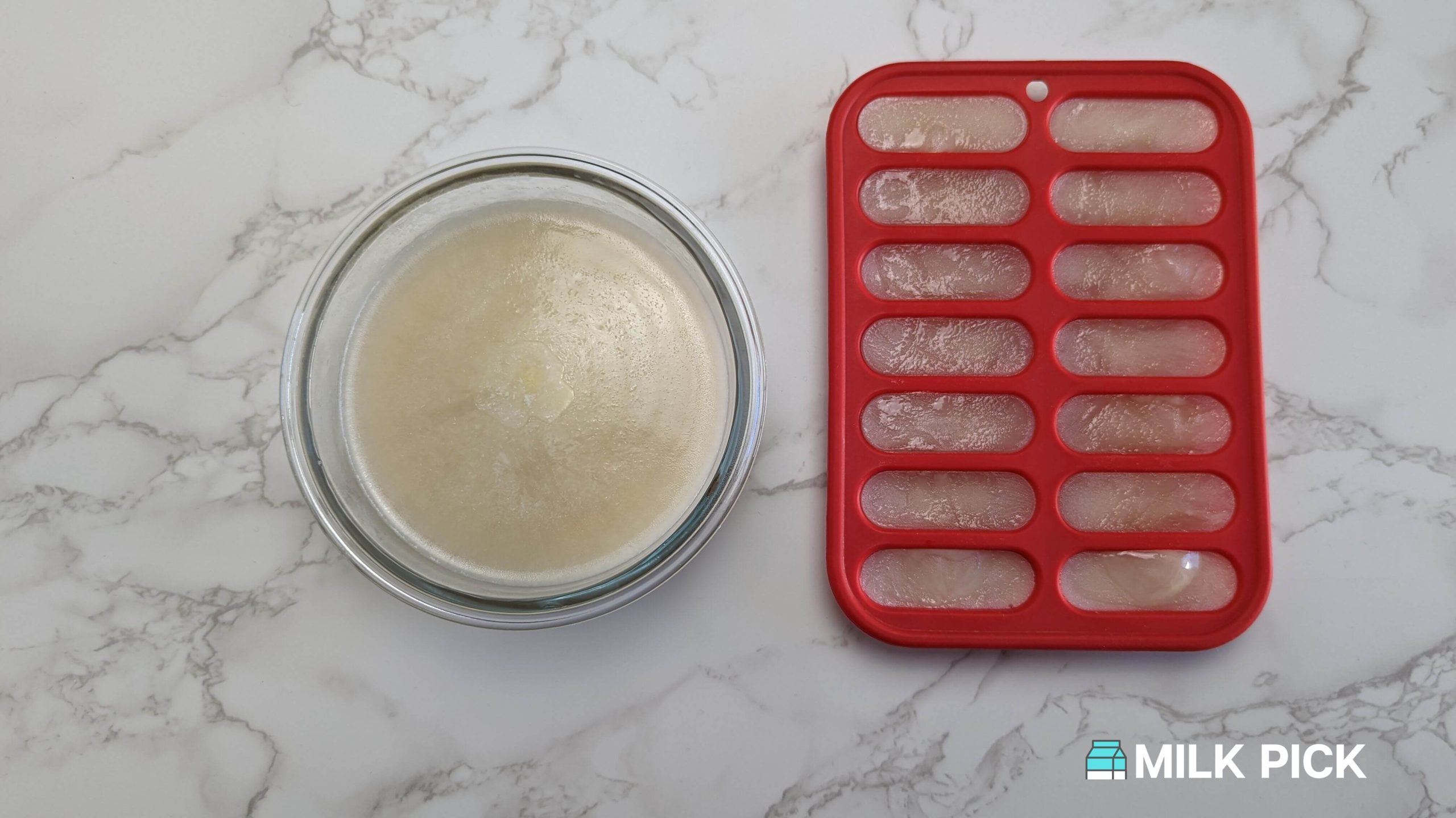 frozen almond milk in glass bowl and ice cube tray side-by-side