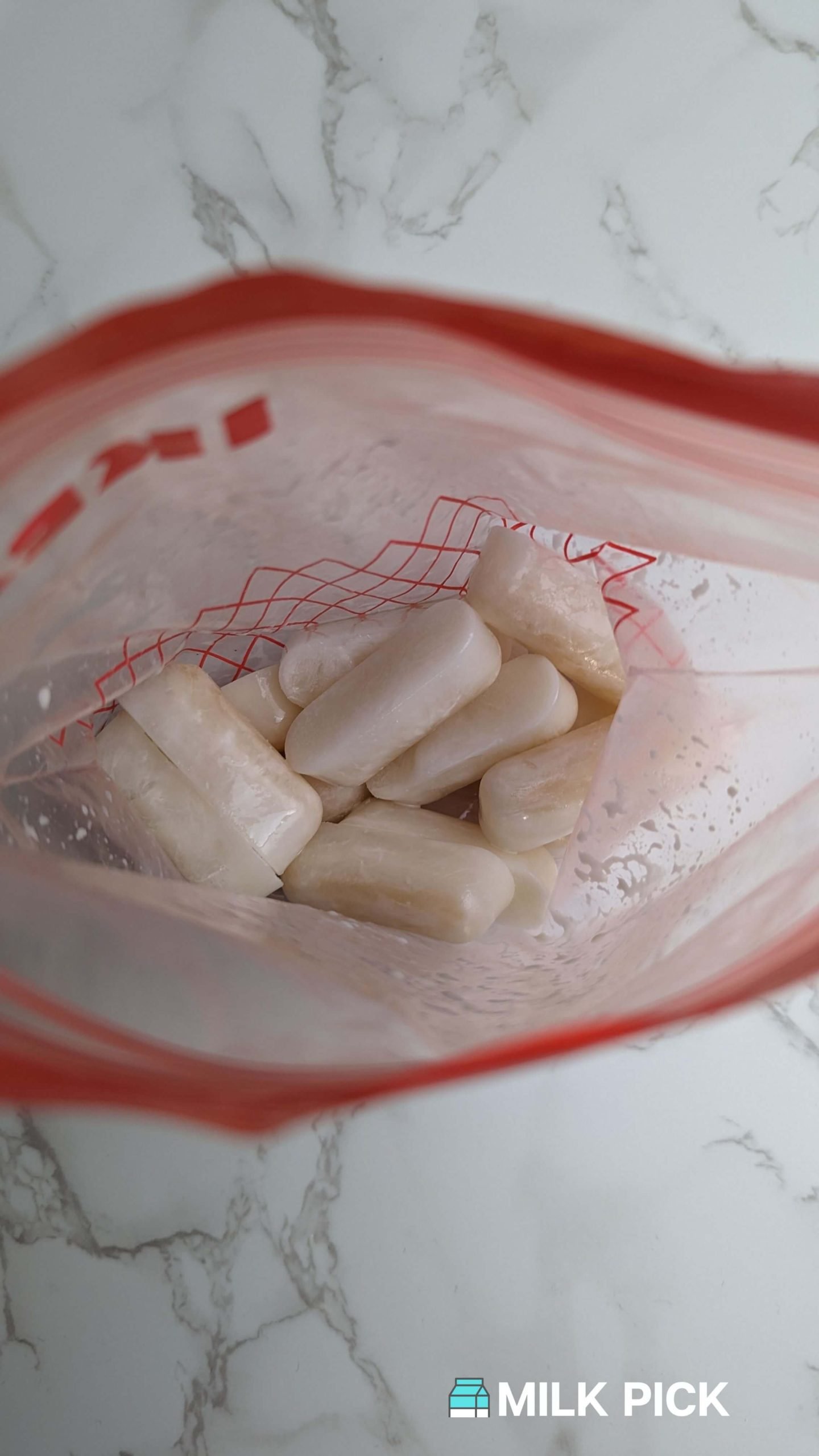 top view of frozen almond milk cubes in plastic bag