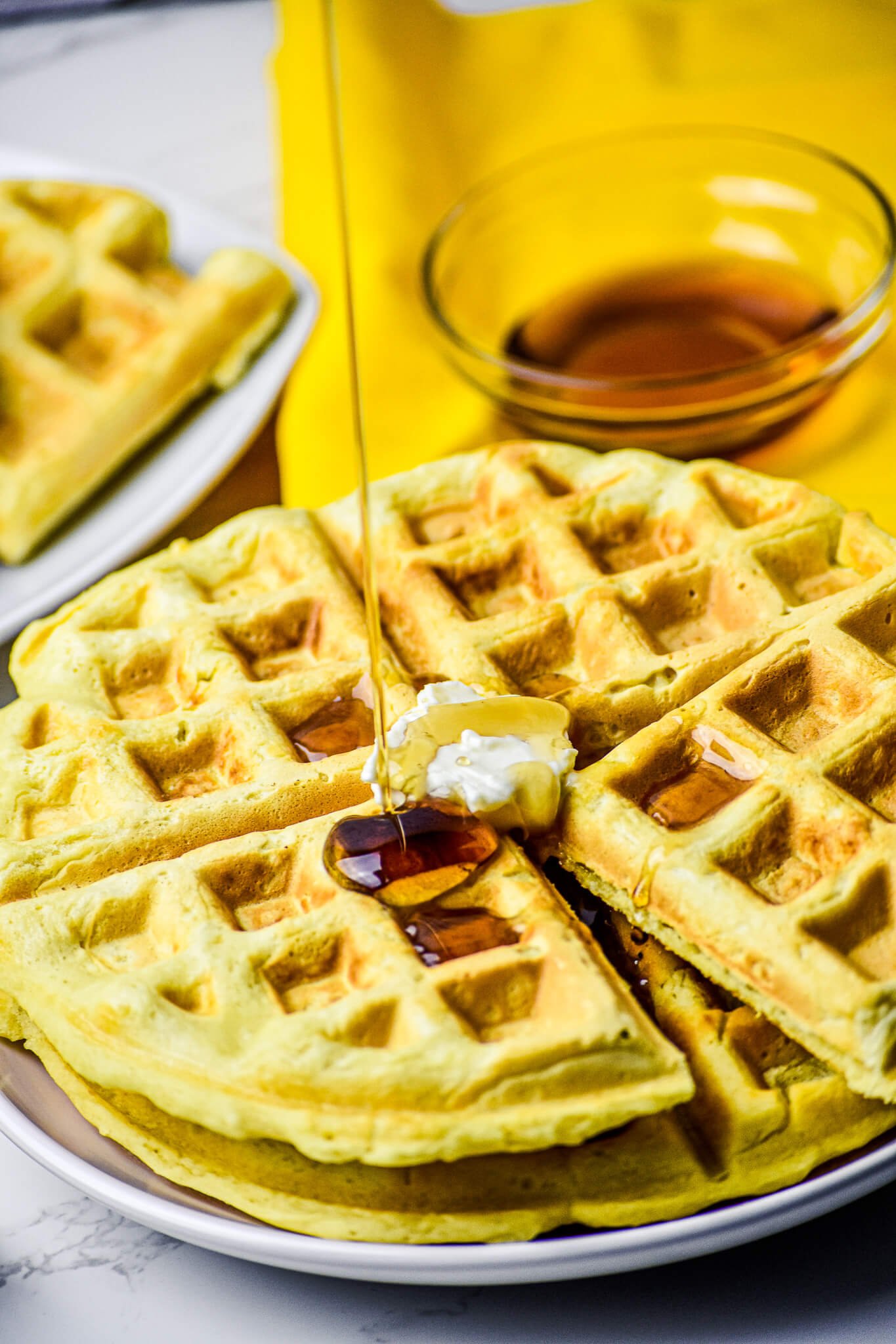 almond milk waffle with syrup pour