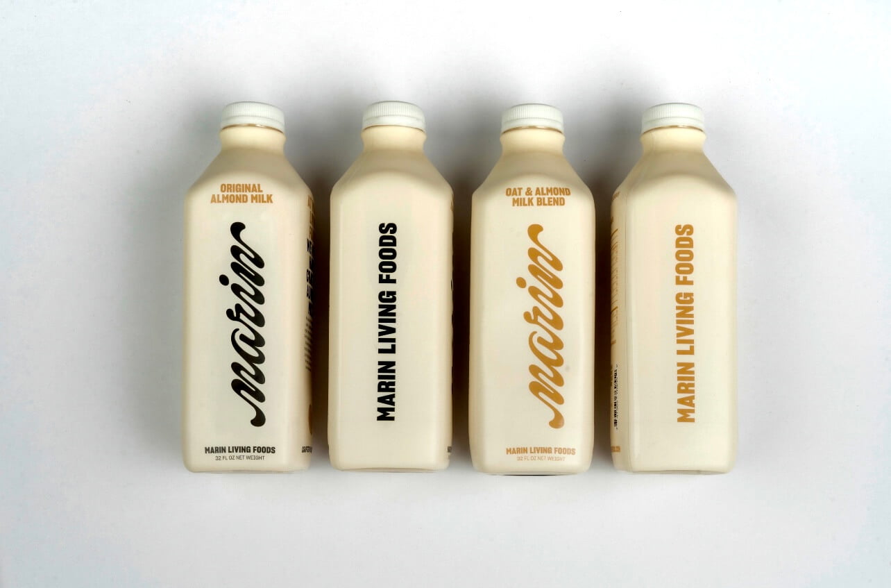 four bottles of marin living foods almond milk