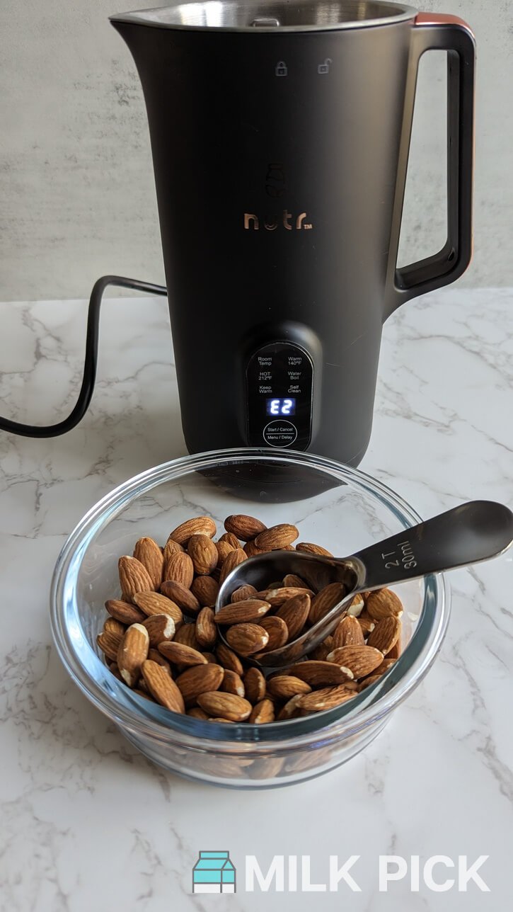 bowl of almonds in front of nutr