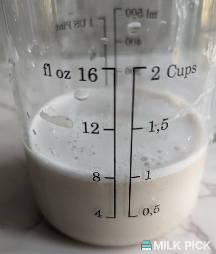 strained nutr almond milk in glass