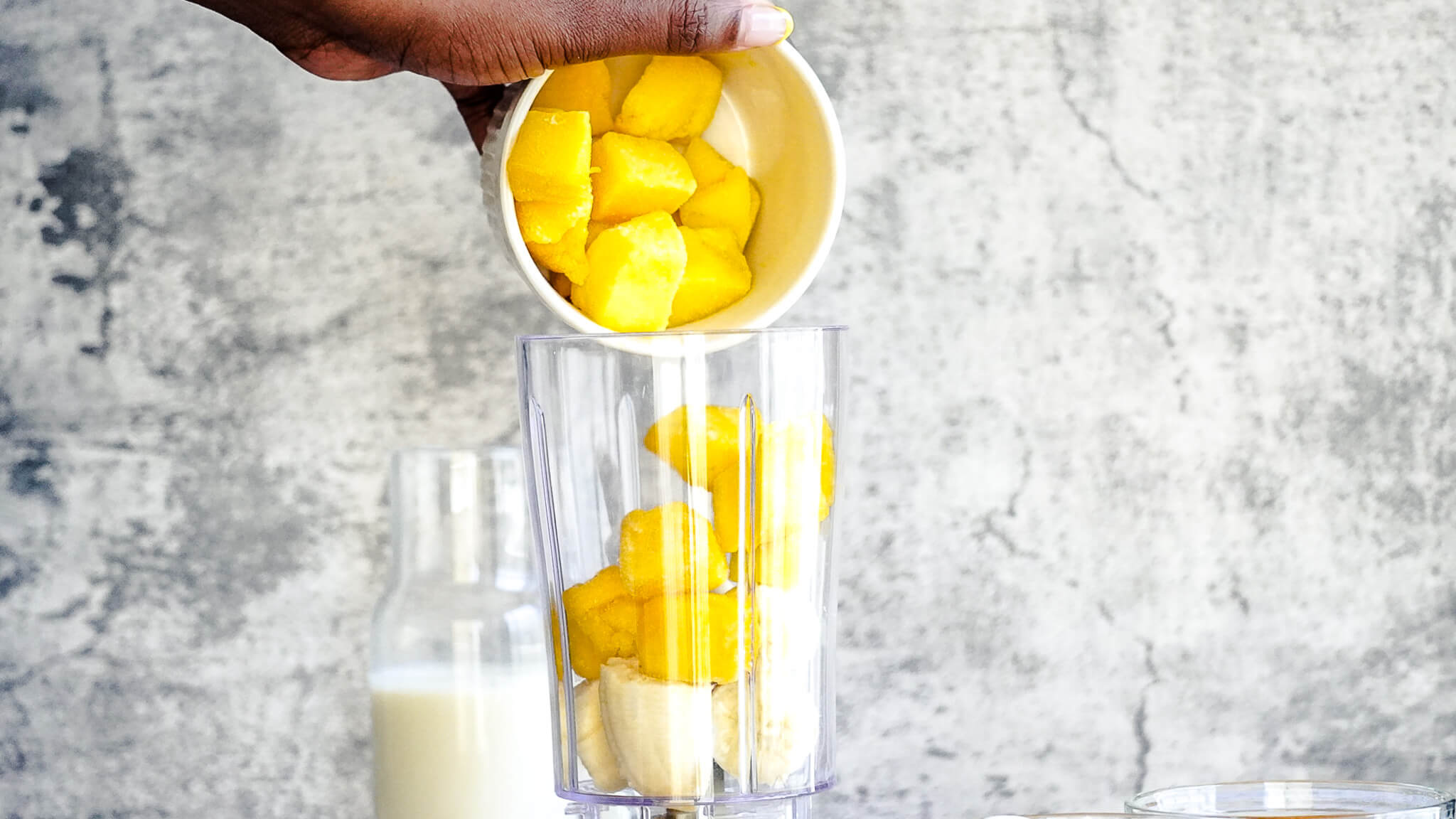 adding mango to blender