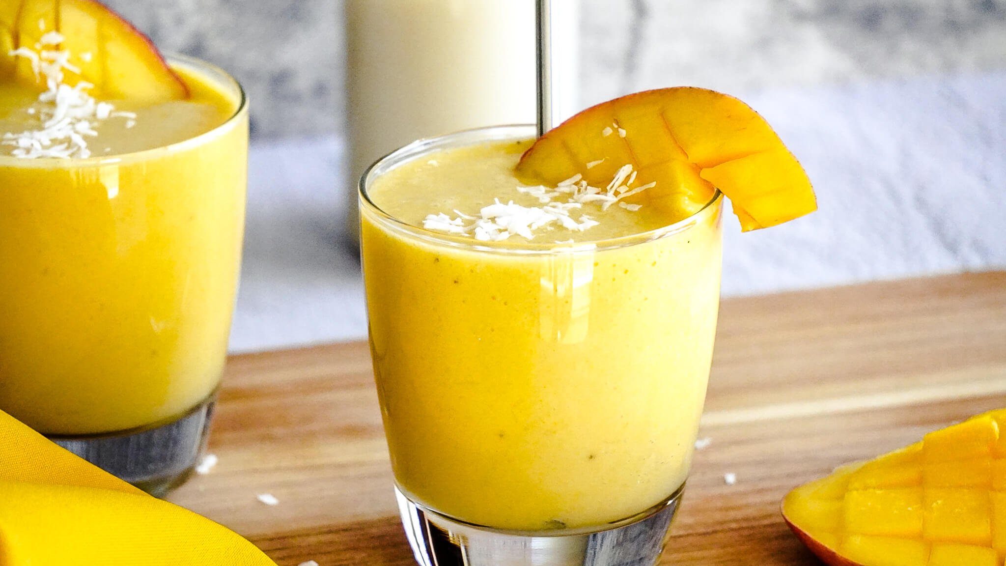 dairy-free mango smoothie topped with coconut
