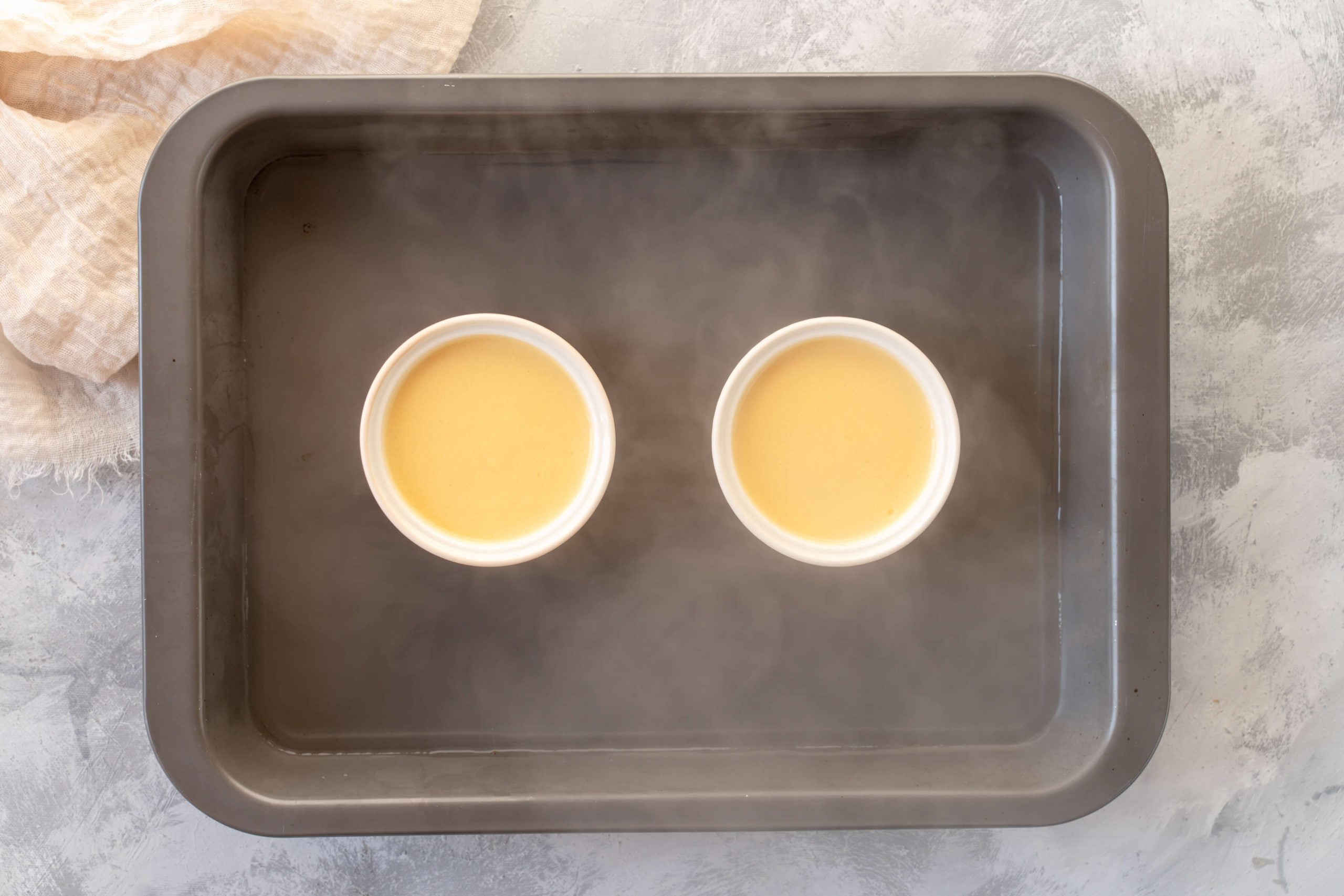 hot water in baking dish with custard