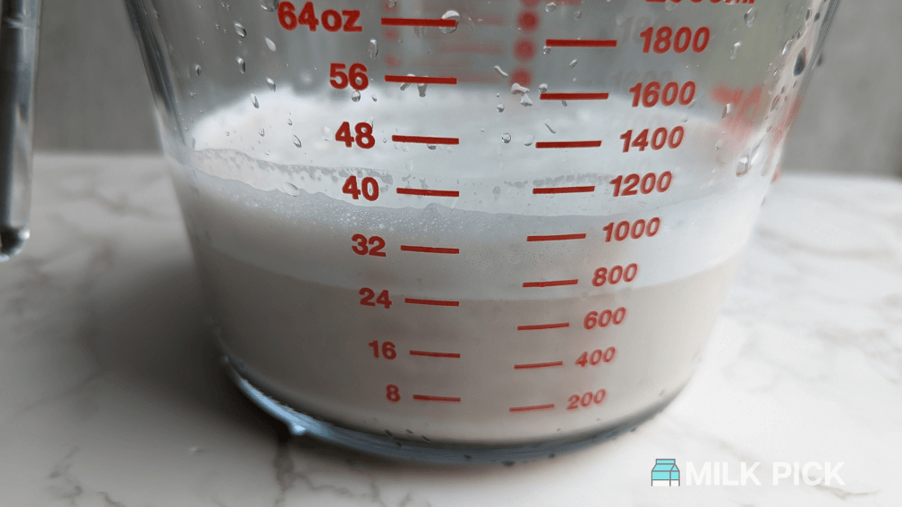 soyabella almond milk in measuring bowl